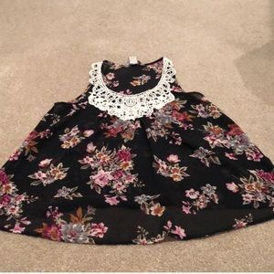 Fun and flirty crochet black floral sheer tank